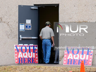 Voters wait in line outside the polling place at a public library in South Austin, Texas, United States, on November 5, 2024. Voters in the...