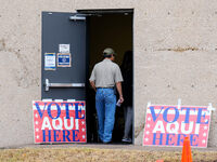 Voters wait in line outside the polling place at a public library in South Austin, Texas, United States, on November 5, 2024. Voters in the...