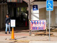 A voter leaves the polling place at a church in West Austin. Voters in the Texas Capital meet with short lines at most polling places across...