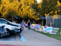 A voter leaves a polling place with her children in suburban Austin, Texas, on November 5, 2024. Voters across the state capital area encoun...