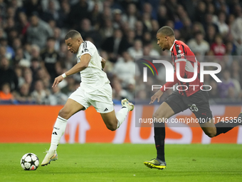 Kylian Mbappe centre-forward of Real Madrid and France and Malick Thiaw centre-back of AC Milan and Germany compete for the ball during the...