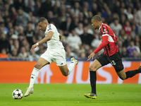 Kylian Mbappe centre-forward of Real Madrid and France and Malick Thiaw centre-back of AC Milan and Germany compete for the ball during the...