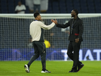 Jude Bellingham central midfield of Real Madrid and England and Tammy Abraham centre-forward of AC Milan and England talks prior the UEFA Ch...