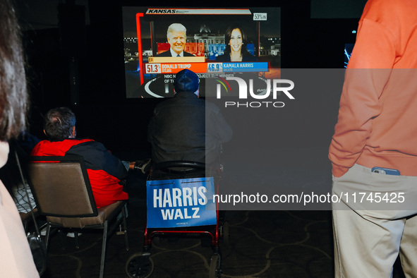 Attendees watch television coverage of the United States 2024 election at the Minnesota DFL Election Night event at the InterContinental Hot...