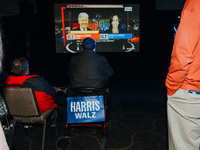 Attendees watch television coverage of the United States 2024 election at the Minnesota DFL Election Night event at the InterContinental Hot...