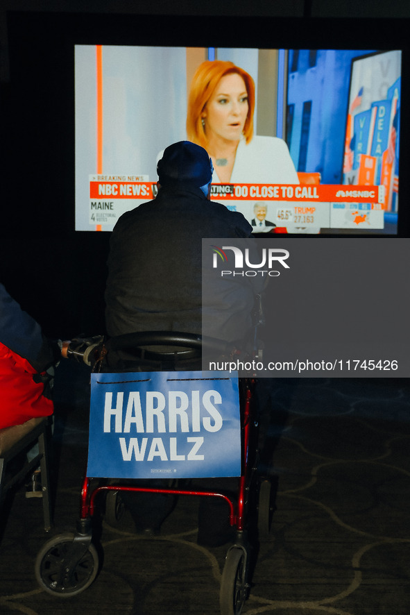 Attendees watch television coverage of the United States 2024 election at the Minnesota DFL Election Night event at the InterContinental Hot...