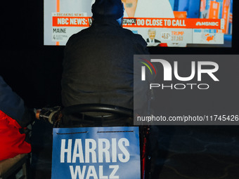 Attendees watch television coverage of the United States 2024 election at the Minnesota DFL Election Night event at the InterContinental Hot...