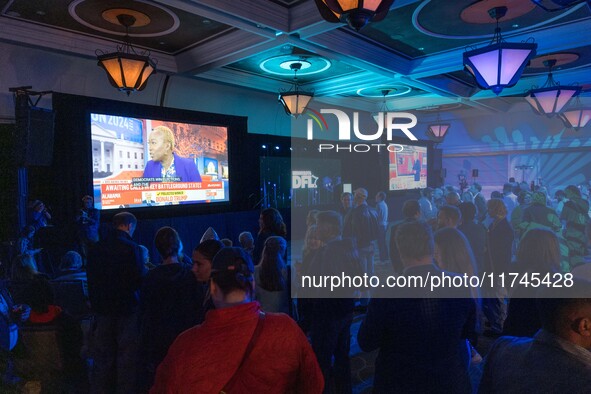 Attendees watch television coverage of the United States 2024 election at the Minnesota DFL Election Night event at the InterContinental Hot...