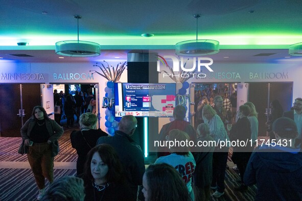 Attendees watch television coverage of the United States 2024 election at the Minnesota DFL Election Night event at the InterContinental Hot...