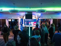 Attendees watch television coverage of the United States 2024 election at the Minnesota DFL Election Night event at the InterContinental Hot...