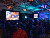 Attendees watch television coverage of the United States 2024 election at the Minnesota DFL Election Night event at the InterContinental Hot...