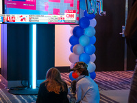 Young attendees watch television coverage of the United States 2024 election at the Minnesota DFL Election Night event at the InterContinent...