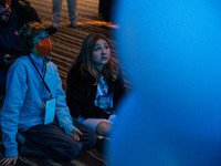 Young attendees watch television coverage of the United States 2024 election at the Minnesota DFL Election Night event at the InterContinent...