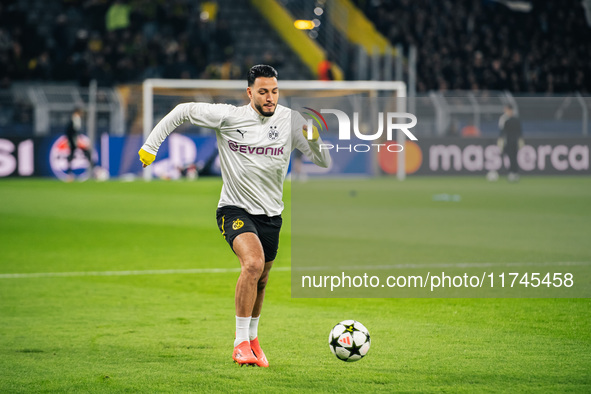 Ramy Bensebaini of Borussia Dortmund warms up before the UEFA Champions League 2024/25 League Phase MD4 soccer match between Borussia Dortmu...