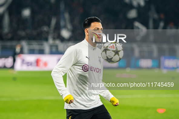 Ramy Bensebaini of Borussia Dortmund warms up before the UEFA Champions League 2024/25 League Phase MD4 soccer match between Borussia Dortmu...