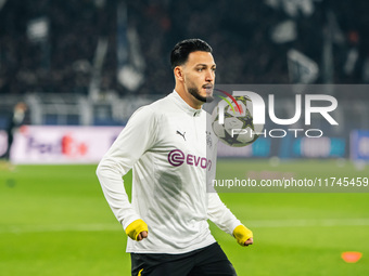 Ramy Bensebaini of Borussia Dortmund warms up before the UEFA Champions League 2024/25 League Phase MD4 soccer match between Borussia Dortmu...