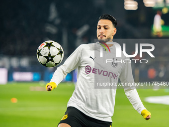 Ramy Bensebaini of Borussia Dortmund warms up before the UEFA Champions League 2024/25 League Phase MD4 soccer match between Borussia Dortmu...