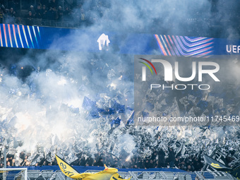 Fans light pyros before the UEFA Champions League 2024/25 League Phase MD4 soccer match between Borussia Dortmund and SK Sturm Graz at BVB S...