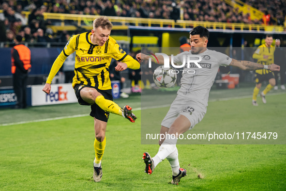 Maximilian Beier of Borussia Dortmund and Jusuf Gazibegovic of SK Sturm Graz are in action during the UEFA Champions League 2024/25 League P...