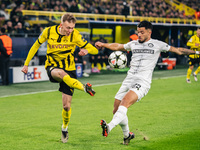 Maximilian Beier of Borussia Dortmund and Jusuf Gazibegovic of SK Sturm Graz are in action during the UEFA Champions League 2024/25 League P...