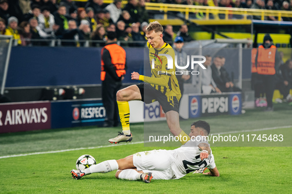 Maximilian Beier of Borussia Dortmund and Jusuf Gazibegovic of SK Sturm Graz are in action during the UEFA Champions League 2024/25 League P...