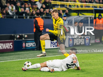 Maximilian Beier of Borussia Dortmund and Jusuf Gazibegovic of SK Sturm Graz are in action during the UEFA Champions League 2024/25 League P...