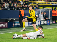 Maximilian Beier of Borussia Dortmund and Jusuf Gazibegovic of SK Sturm Graz are in action during the UEFA Champions League 2024/25 League P...