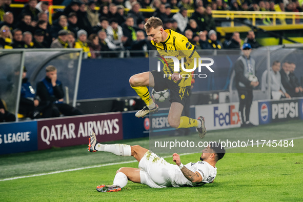 Maximilian Beier of Borussia Dortmund and Jusuf Gazibegovic of SK Sturm Graz are in action during the UEFA Champions League 2024/25 League P...