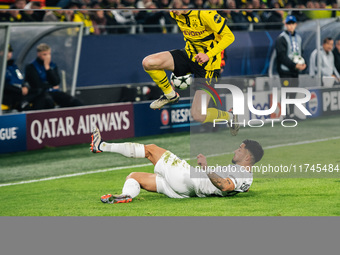 Maximilian Beier of Borussia Dortmund and Jusuf Gazibegovic of SK Sturm Graz are in action during the UEFA Champions League 2024/25 League P...