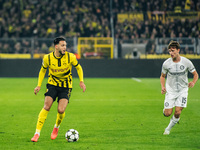 Ramy Bensebaini of Borussia Dortmund and William Boving of SK Sturm Graz play during the UEFA Champions League 2024/25 League Phase MD4 socc...