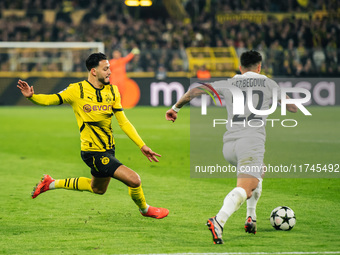 Ramy Bensebaini of Borussia Dortmund and Jusuf Gazibegovic of SK Sturm Graz are in action during the UEFA Champions League 2024/25 League Ph...