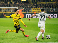 Ramy Bensebaini of Borussia Dortmund and Jusuf Gazibegovic of SK Sturm Graz are in action during the UEFA Champions League 2024/25 League Ph...