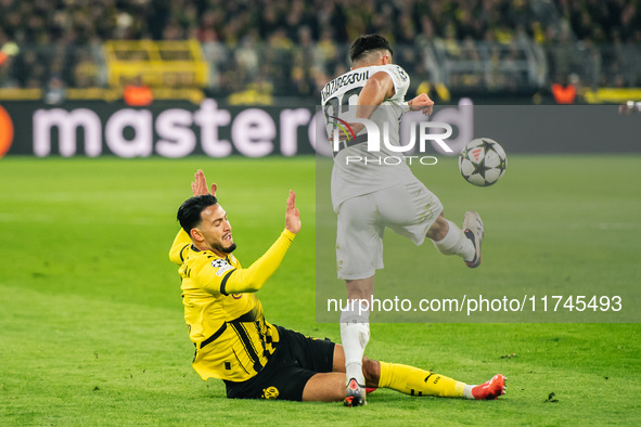 Ramy Bensebaini of Borussia Dortmund and Jusuf Gazibegovic of SK Sturm Graz are in action during the UEFA Champions League 2024/25 League Ph...