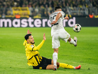 Ramy Bensebaini of Borussia Dortmund and Jusuf Gazibegovic of SK Sturm Graz are in action during the UEFA Champions League 2024/25 League Ph...