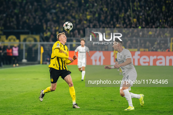 Maximilian Beier of Borussia Dortmund and Dimitri Lavalee of SK Sturm Graz are in action during the UEFA Champions League 2024/25 League Pha...