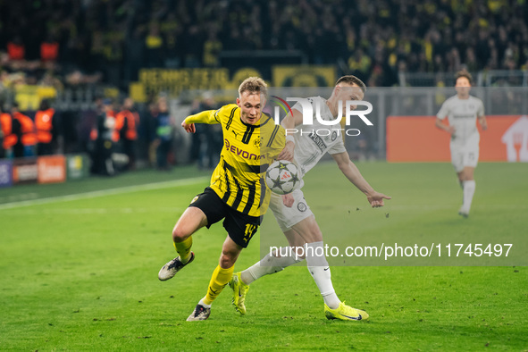 Maximilian Beier of Borussia Dortmund and Dimitri Lavalee of SK Sturm Graz are in action during the UEFA Champions League 2024/25 League Pha...