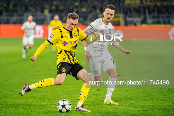 Maximilian Beier of Borussia Dortmund and Dimitri Lavalee of SK Sturm Graz are in action during the UEFA Champions League 2024/25 League Pha...