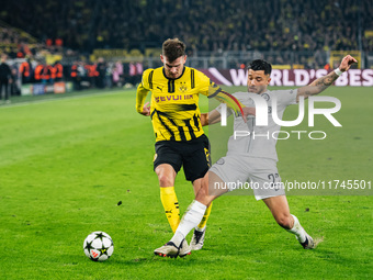 Pascal Gross of Borussia Dortmund and Jusuf Gazibegovic of SK Sturm Graz play during the UEFA Champions League 2024/25 League Phase MD4 socc...