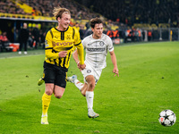 Julian Brandt of Borussia Dortmund and William Boving of SK Sturm Graz play during the UEFA Champions League 2024/25 League Phase MD4 soccer...