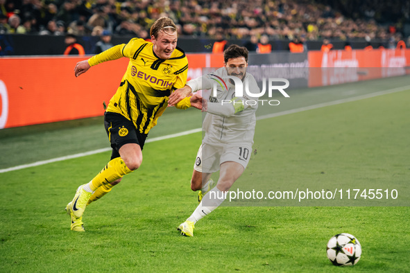 Julian Brandt of Borussia Dortmund and Otar Kiteishvili of SK Sturm Graz are in action during the UEFA Champions League 2024/25 League Phase...