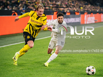 Julian Brandt of Borussia Dortmund and Otar Kiteishvili of SK Sturm Graz are in action during the UEFA Champions League 2024/25 League Phase...