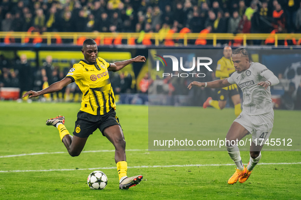 Serhou Guirassy of Borussia Dortmund and Emanuel Aiwu of SK Sturm Graz are in action during the UEFA Champions League 2024/25 League Phase M...