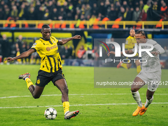 Serhou Guirassy of Borussia Dortmund and Emanuel Aiwu of SK Sturm Graz are in action during the UEFA Champions League 2024/25 League Phase M...