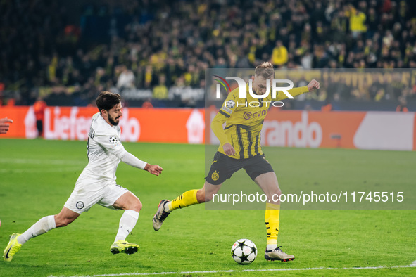 Maximilian Beier of Borussia Dortmund and Otar Kiteishvili of SK Sturm Graz play during the UEFA Champions League 2024/25 League Phase MD4 s...