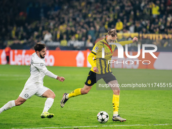 Maximilian Beier of Borussia Dortmund and Otar Kiteishvili of SK Sturm Graz play during the UEFA Champions League 2024/25 League Phase MD4 s...