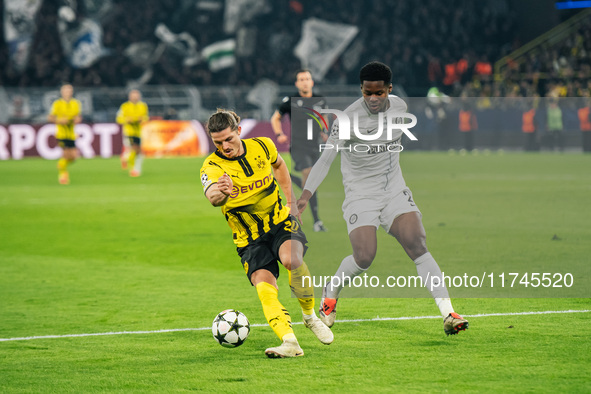 Marcel Sabitzer of Borussia Dortmund and Tochi Chukwuani of SK Sturm Graz are in action during the UEFA Champions League 2024/25 League Phas...