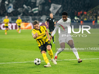 Marcel Sabitzer of Borussia Dortmund and Tochi Chukwuani of SK Sturm Graz are in action during the UEFA Champions League 2024/25 League Phas...