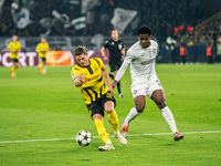 Marcel Sabitzer of Borussia Dortmund and Tochi Chukwuani of SK Sturm Graz are in action during the UEFA Champions League 2024/25 League Phas...