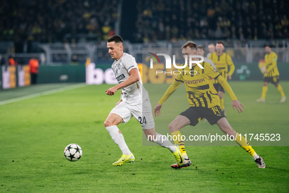 Maximilian Beier of Borussia Dortmund and Dimitri Lavalee of SK Sturm Graz are in action during the UEFA Champions League 2024/25 League Pha...