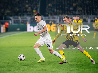 Maximilian Beier of Borussia Dortmund and Dimitri Lavalee of SK Sturm Graz are in action during the UEFA Champions League 2024/25 League Pha...